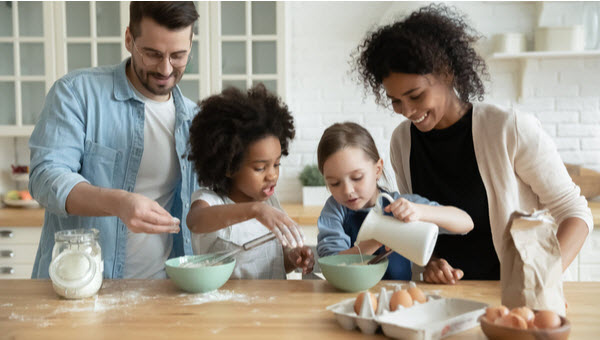 Cafs Foster Care process, with foster care family baking together.