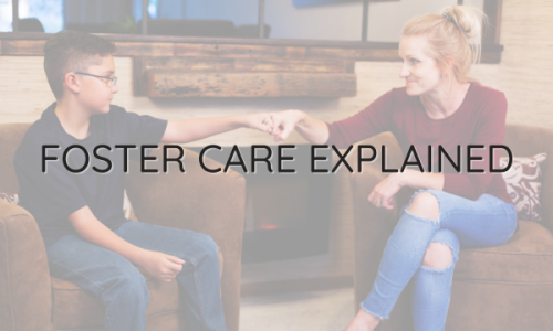 Foster carer with their foster child discussing the fostering process.